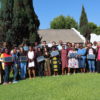 Participants pose with their SolarSPELLL devices for a group photo at the Peace Corps Lesotho teacher training.